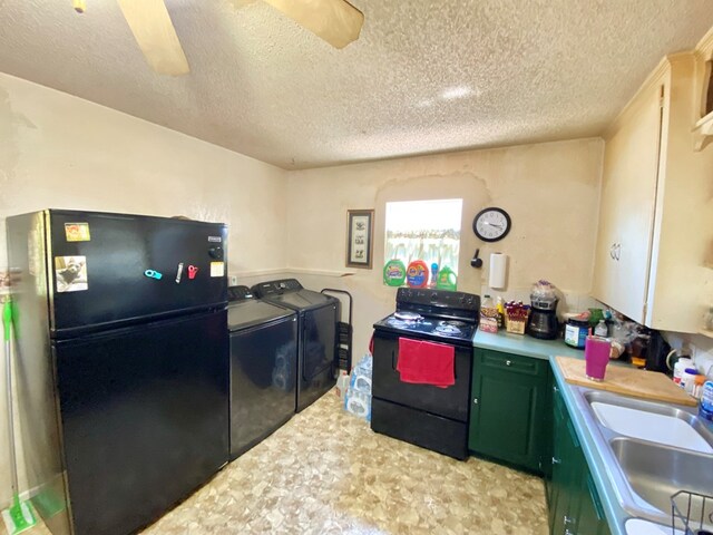 kitchen featuring sink, a textured ceiling, black appliances, washer and dryer, and green cabinetry