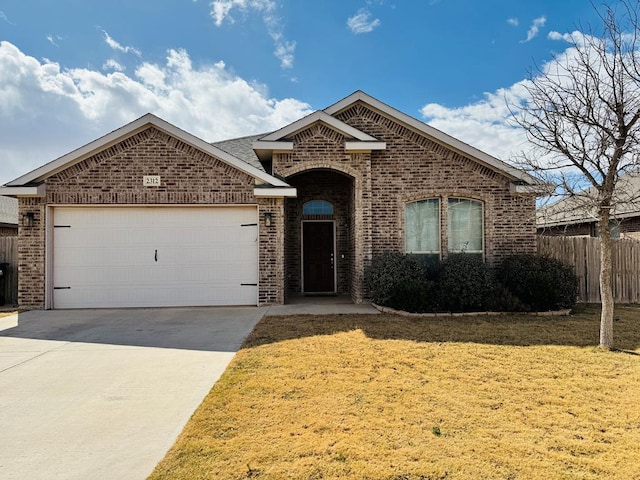 ranch-style house with brick siding, an attached garage, driveway, and a front lawn