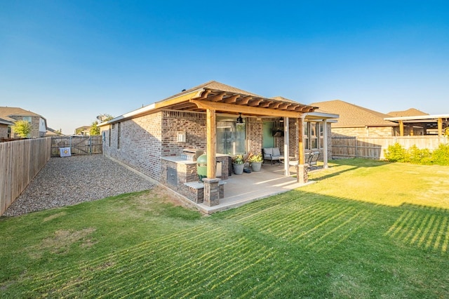 rear view of house with a pergola, a patio, a fenced backyard, a yard, and brick siding