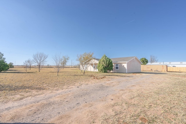 view of yard with a rural view