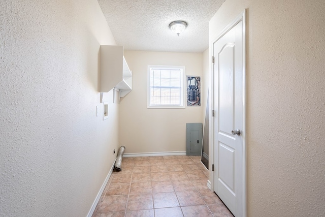 laundry room featuring hookup for a washing machine and a textured ceiling