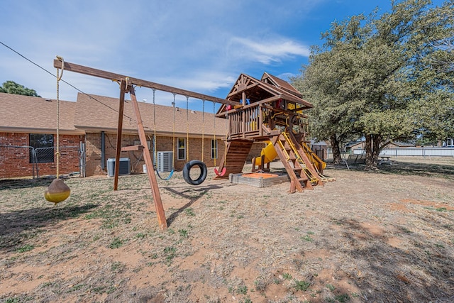 view of play area with central AC unit and fence