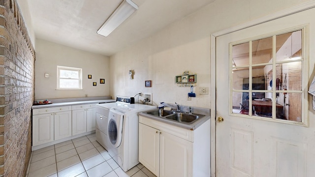 2701 S County Rd 1114, Midland, TX 79706 - laundry area featuring cabinet space, light tile patterned floors, washer and clothes dryer, and a sink