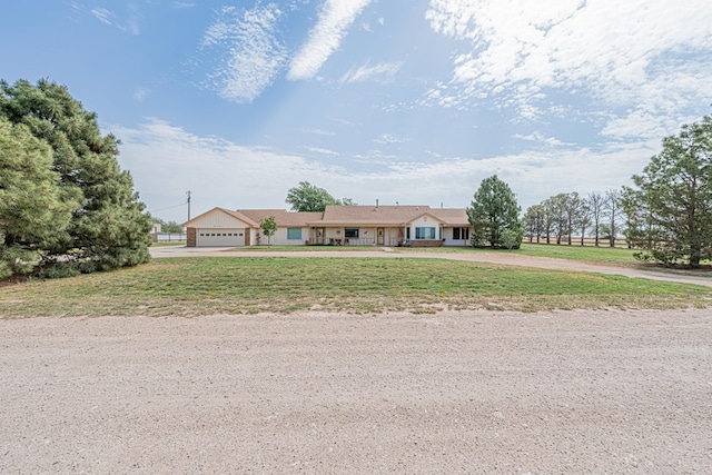 2701 S County Rd 1114, Midland, TX 79706 - ranch-style house with curved driveway and a front lawn