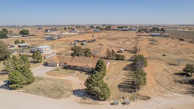 birds eye view of property with a rural view