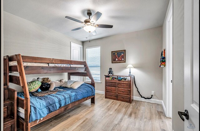 313 Peregrine Hill Cir, Midland, TX 79707 - bedroom featuring baseboards, a ceiling fan, and wood finished floors