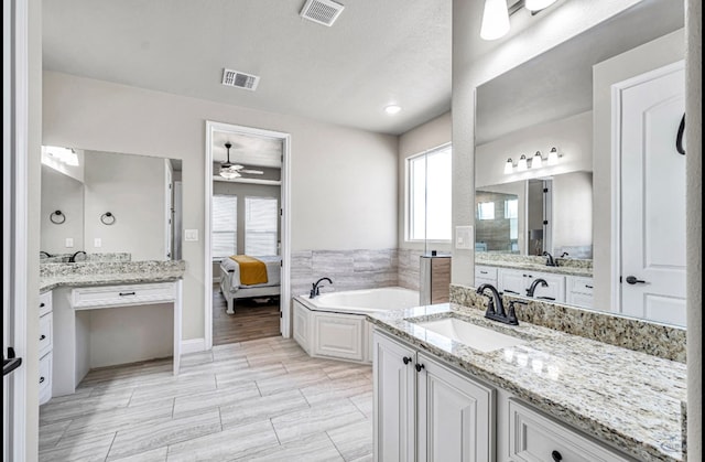 313 Peregrine Hill Cir, Midland, TX 79707 - bathroom with a sink, visible vents, ceiling fan, and a bath