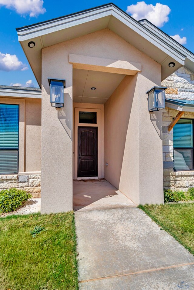 313 Peregrine Hill Cir, Midland, TX 79707 - entrance to property featuring stucco siding and stone siding