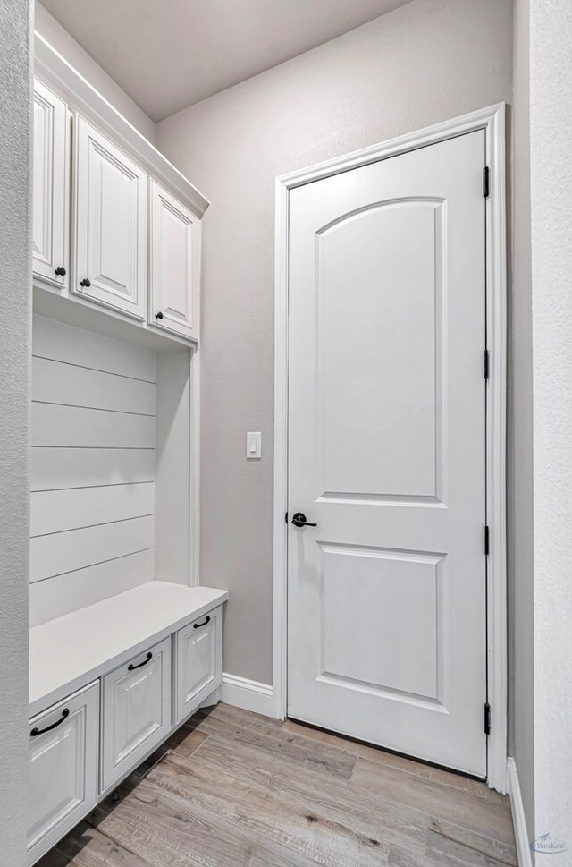 313 Peregrine Hill Cir, Midland, TX 79707 - mudroom featuring light wood-style floors and baseboards