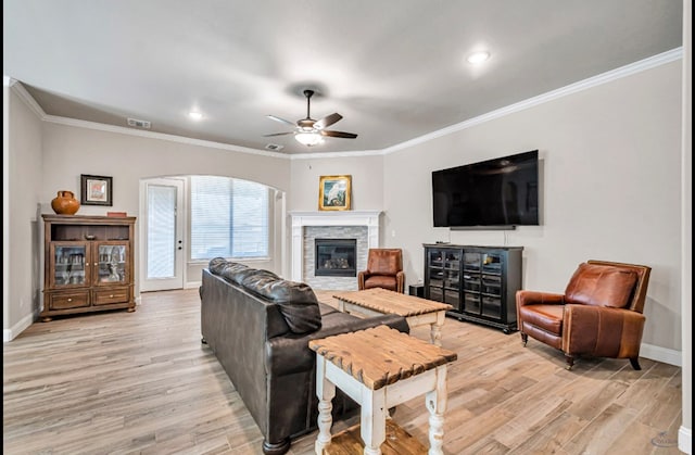 313 Peregrine Hill Cir, Midland, TX 79707 - living area featuring baseboards, ornamental molding, light wood-style flooring, a ceiling fan, and visible vents