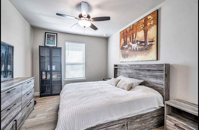 313 Peregrine Hill Cir, Midland, TX 79707 - bedroom featuring light wood-style flooring and ceiling fan