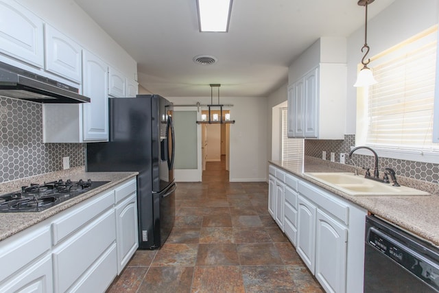 kitchen with visible vents, white cabinets, black appliances, and a sink