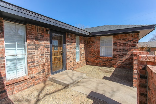 entrance to property with brick siding