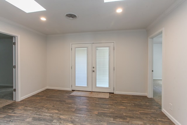 unfurnished room featuring visible vents, wood finished floors, recessed lighting, french doors, and crown molding