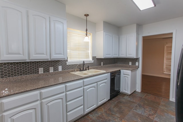 kitchen featuring white cabinetry, a sink, hanging light fixtures, dishwasher, and tasteful backsplash