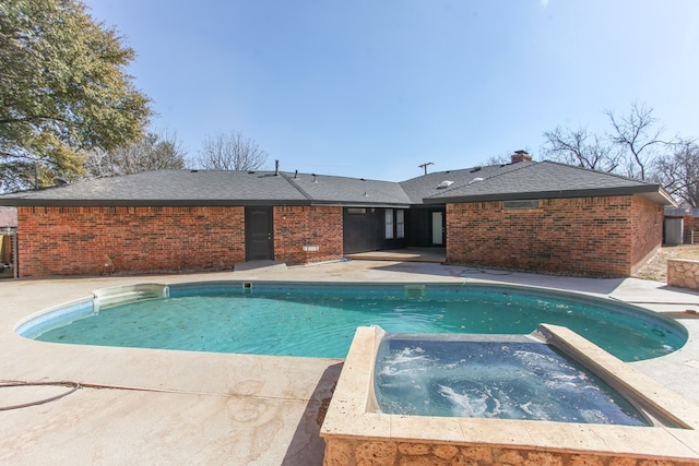 view of pool featuring a fenced in pool, a patio, and an in ground hot tub