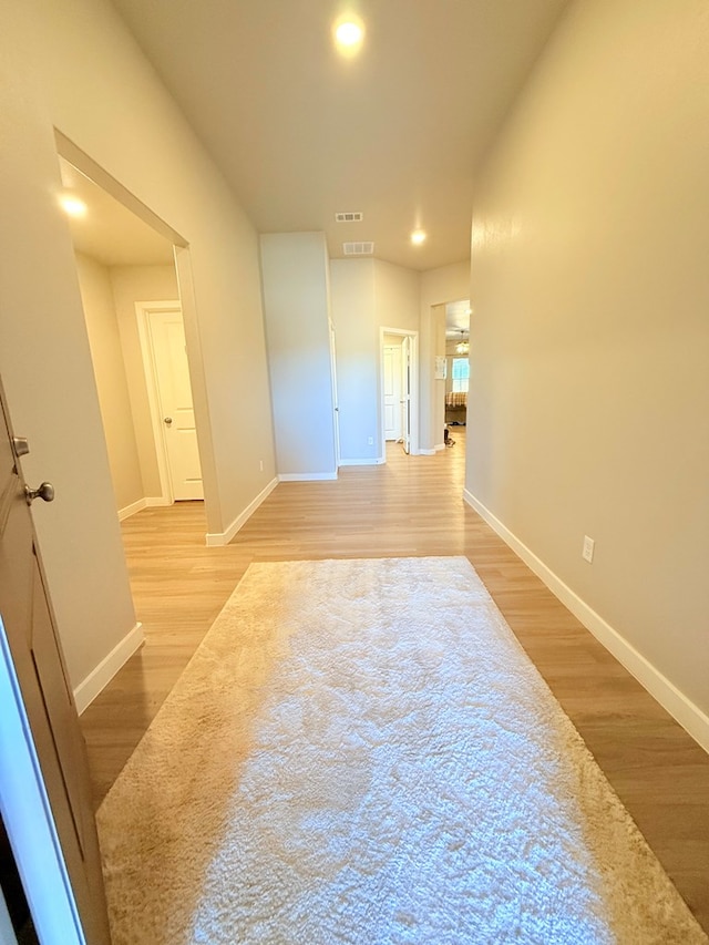 spare room with light hardwood / wood-style floors