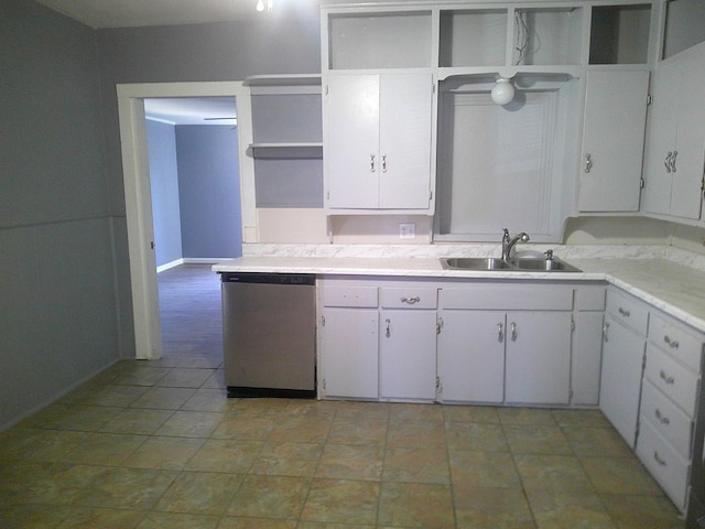 kitchen with white cabinets, stainless steel dishwasher, and sink