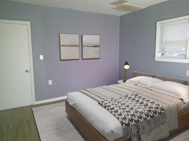 bedroom with wood-type flooring