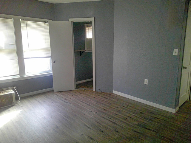 unfurnished bedroom featuring a closet and wood-type flooring