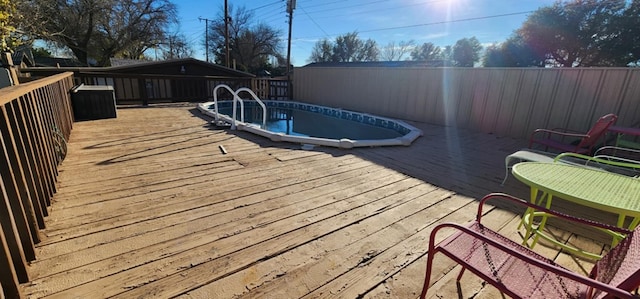 view of swimming pool featuring a deck