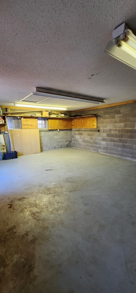 interior space with concrete block wall