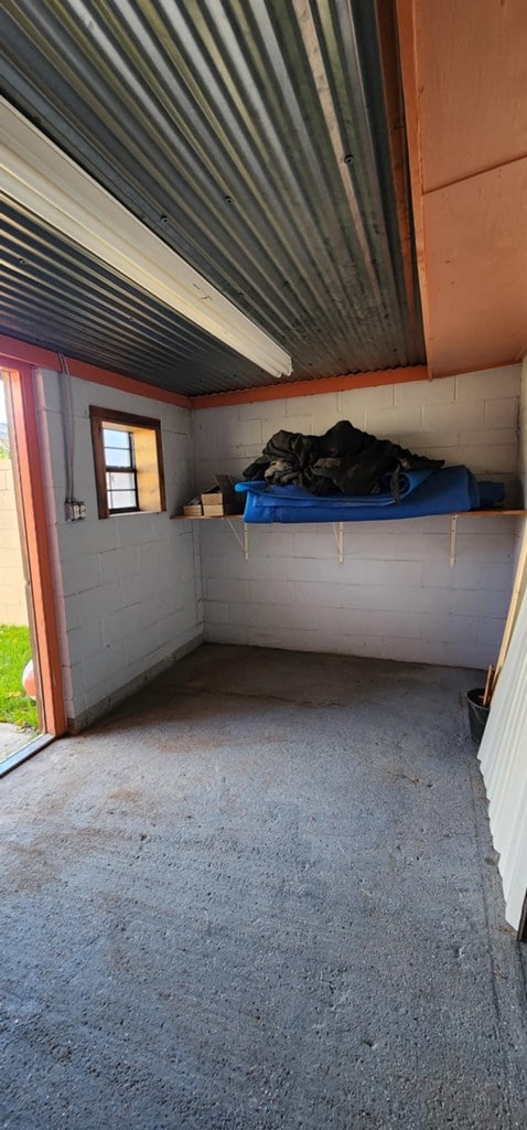 interior space featuring concrete block wall