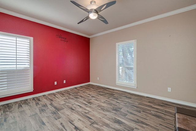 unfurnished room with ceiling fan, baseboards, ornamental molding, and wood finished floors