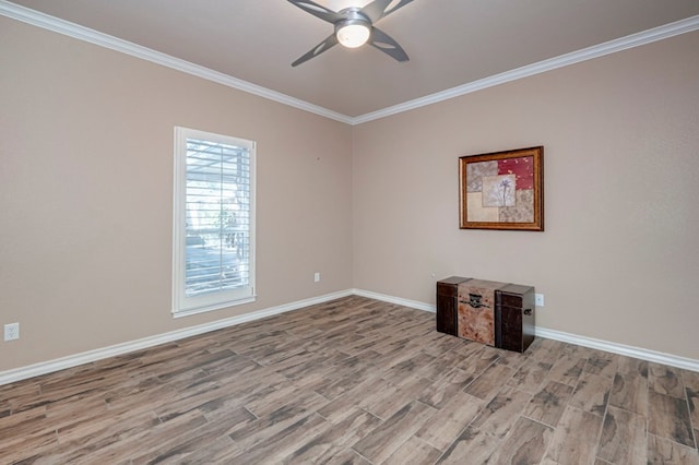 empty room featuring crown molding, ceiling fan, baseboards, and wood finished floors