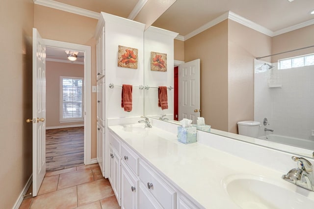 full bath with a sink, crown molding, and double vanity