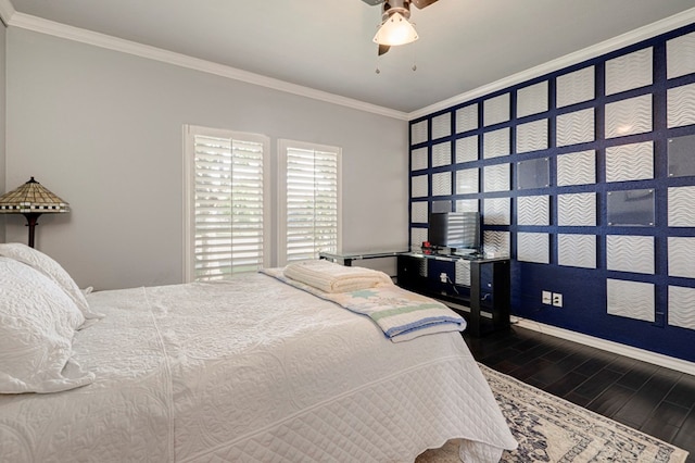 bedroom featuring crown molding, a ceiling fan, baseboards, and dark wood-style floors