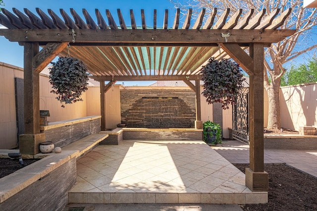 view of patio with a fenced backyard and a pergola