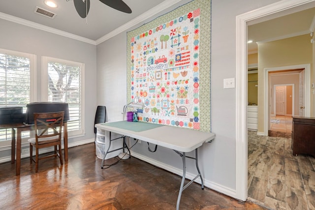 office area with crown molding, baseboards, a ceiling fan, and visible vents