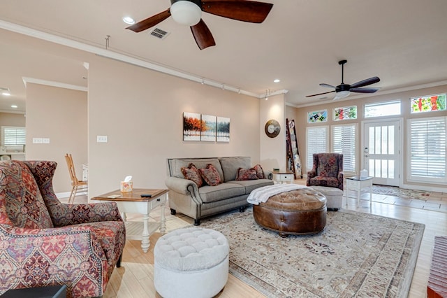 living room featuring visible vents, ornamental molding, ceiling fan, and recessed lighting