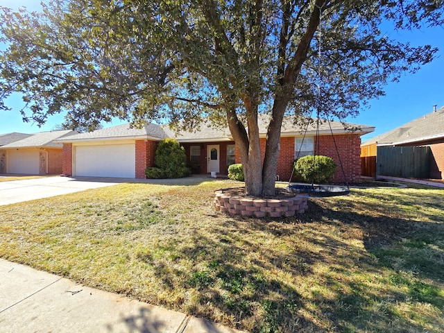 ranch-style house with a garage and a front yard