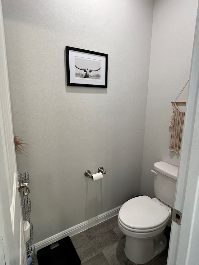 8409 E County Rd 113, Midland, TX 79706 - bathroom with toilet and baseboards