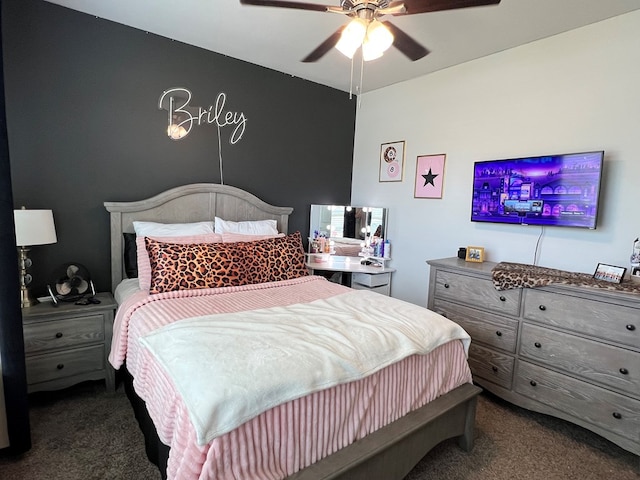 8409 E County Rd 113, Midland, TX 79706 - bedroom with dark colored carpet and a ceiling fan