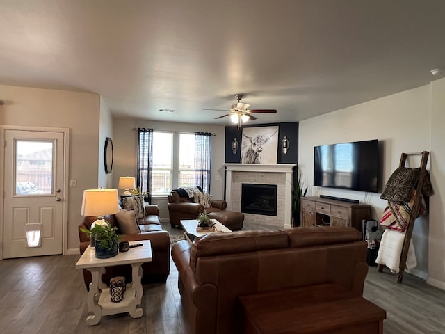 8409 E County Rd 113, Midland, TX 79706 - living room featuring a brick fireplace, wood finished floors, ceiling fan, and baseboards