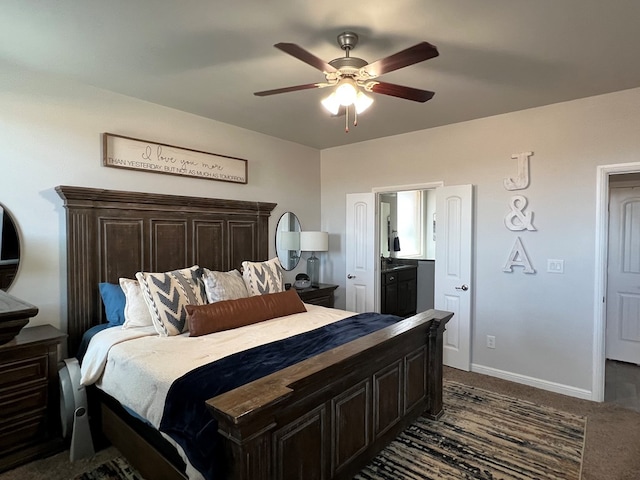 8409 E County Rd 113, Midland, TX 79706 - bedroom with dark colored carpet, a ceiling fan, baseboards, and connected bathroom