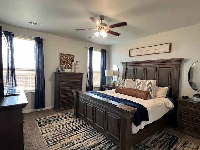 8409 E County Rd 113, Midland, TX 79706 - bedroom with carpet floors, a ceiling fan, and baseboards