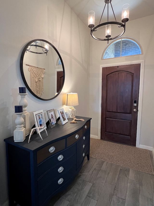 8409 E County Rd 113, Midland, TX 79706 - entrance foyer featuring a chandelier, wood finish floors, and baseboards