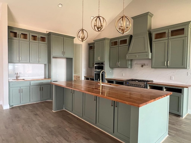 5605 E County Rd 94, Midland, TX 79706 - kitchen featuring a sink, butcher block counters, a chandelier, backsplash, and high vaulted ceiling