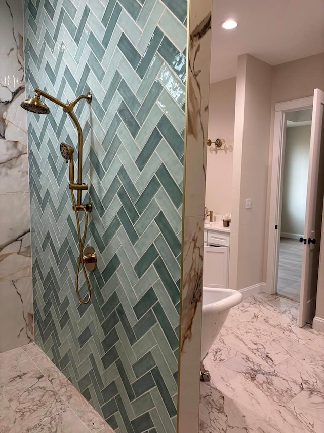 5605 E County Rd 94, Midland, TX 79706 - bathroom with tiled shower, vanity, marble finish floors, and recessed lighting
