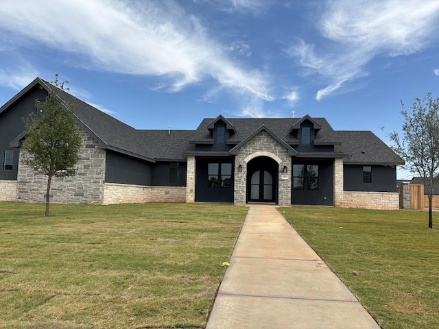 5605 E County Rd 94, Midland, TX 79706 - french country inspired facade with stone siding, a shingled roof, and a front yard