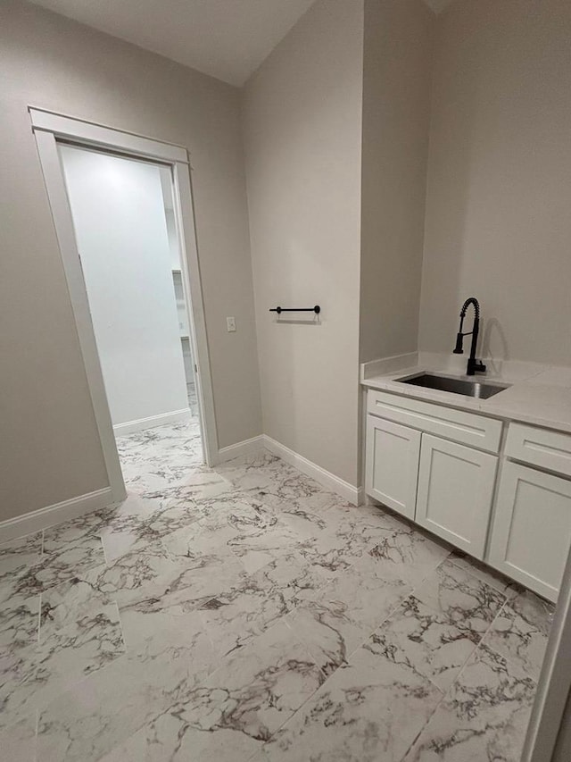 5605 E County Rd 94, Midland, TX 79706 - bathroom featuring marble finish flooring, vanity, and baseboards