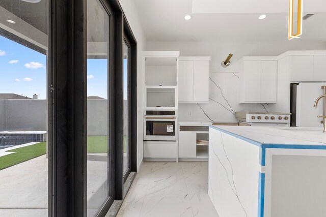 2607 Hoya Dr, Midland, TX 79707 - washroom featuring light marble finish flooring and recessed lighting
