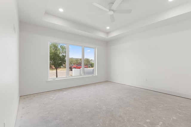 2607 Hoya Dr, Midland, TX 79707 - unfurnished room with a raised ceiling, recessed lighting, concrete flooring, and a ceiling fan