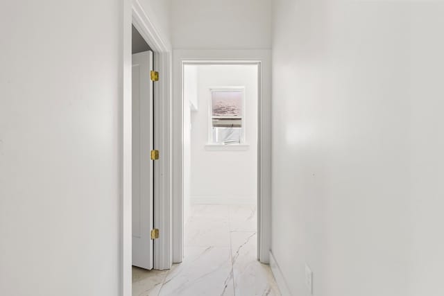 2607 Hoya Dr, Midland, TX 79707 - hallway featuring light marble finish floors and baseboards
