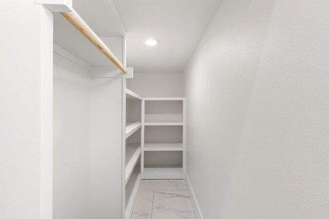 2607 Hoya Dr, Midland, TX 79707 - walk in closet with light marble finish flooring