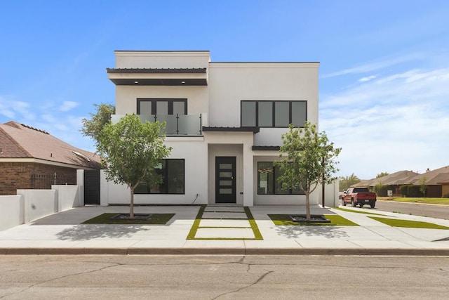 2607 Hoya Dr, Midland, TX 79707 - contemporary house featuring stucco siding and a balcony